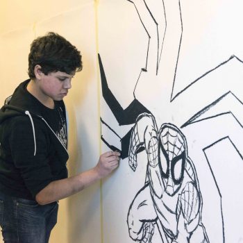 A student at work creating something for our Out of My Roots Student Art projects from Athena Syntax: an education programme that explores questions of identity through art.